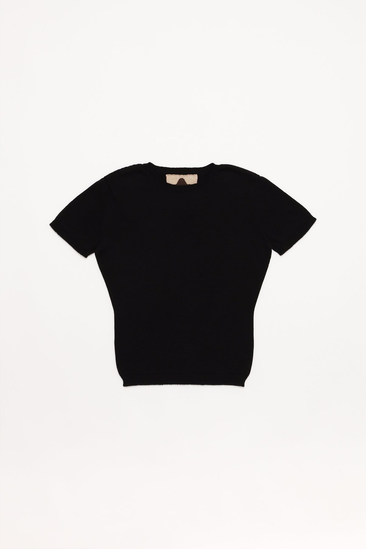 Fruitchouli Plain Knit Baby Tee in Black Organic Cotton SeaCell™ – Australian knitwear (Flat Lay Front)