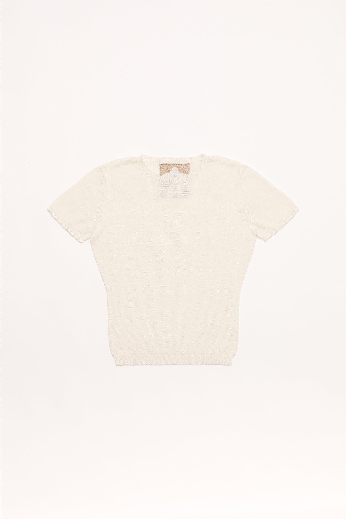 Fruitchouli Plain Knit Baby Tee in White Organic Cotton SeaCell™ – Australian knitwear (Flat Lay Front)